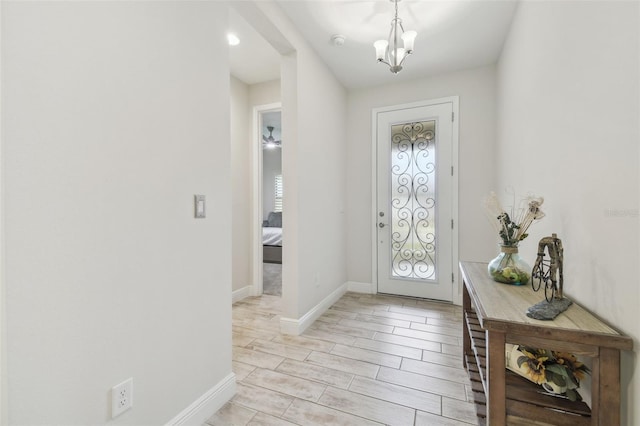 entrance foyer featuring a notable chandelier