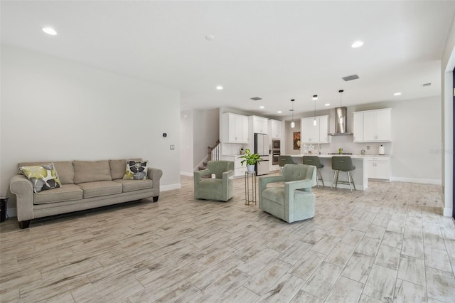 living room with light hardwood / wood-style floors