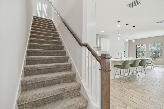 stairs featuring sink