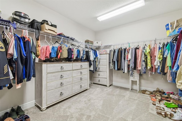 spacious closet with carpet floors