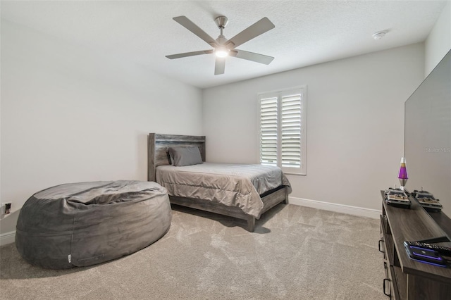 bedroom with ceiling fan and light colored carpet