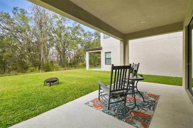 view of patio featuring an outdoor fire pit