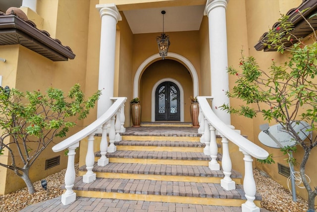 entrance to property featuring french doors