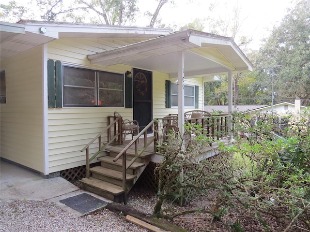 entrance to property with a porch