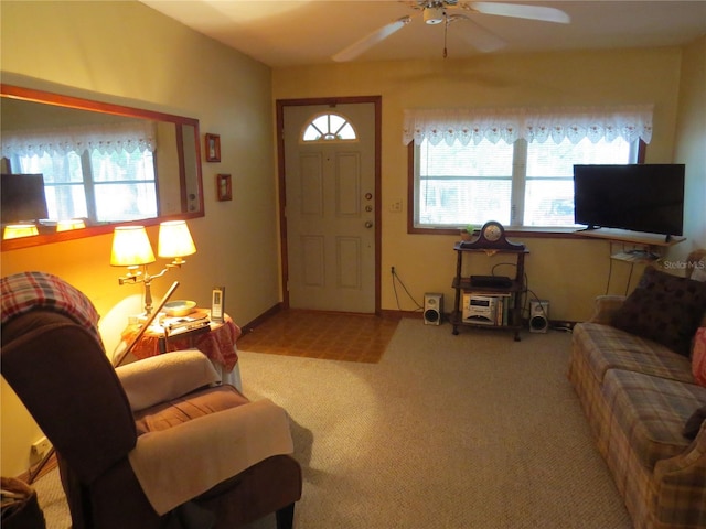 living room featuring ceiling fan and carpet flooring