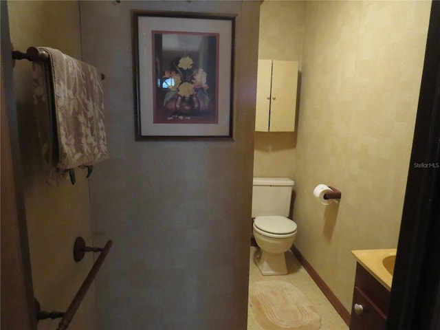 bathroom with toilet and vanity