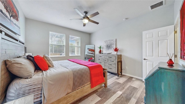 bedroom featuring ceiling fan and light hardwood / wood-style flooring