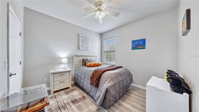 bedroom featuring ceiling fan and light wood-type flooring