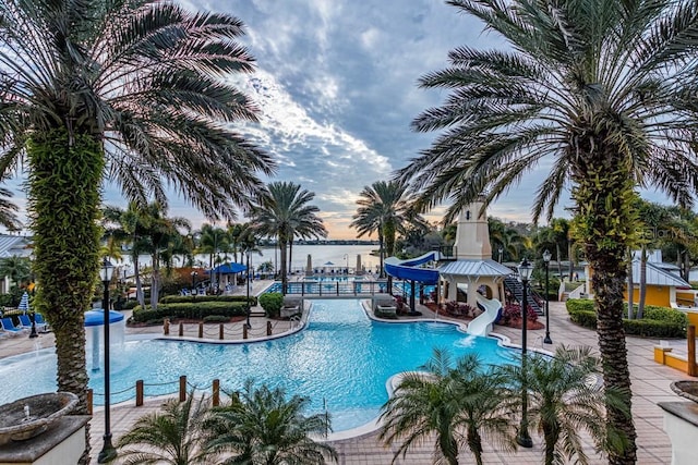 view of swimming pool featuring a patio area and a water slide