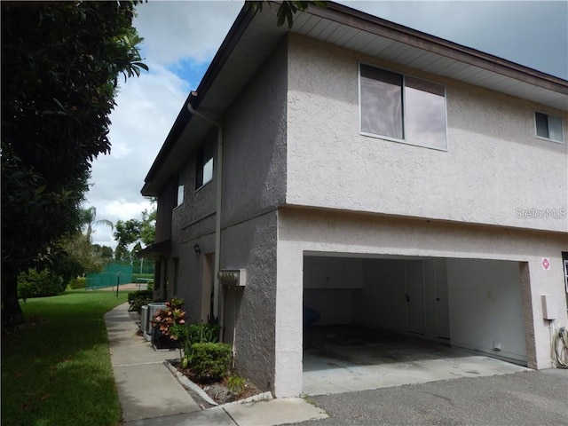 view of property exterior with a garage