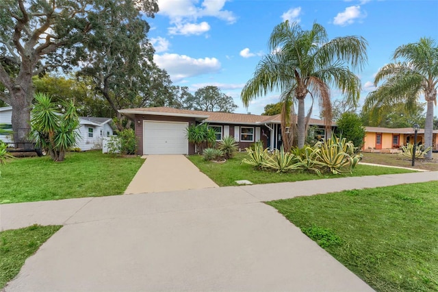 single story home with a front lawn and a garage