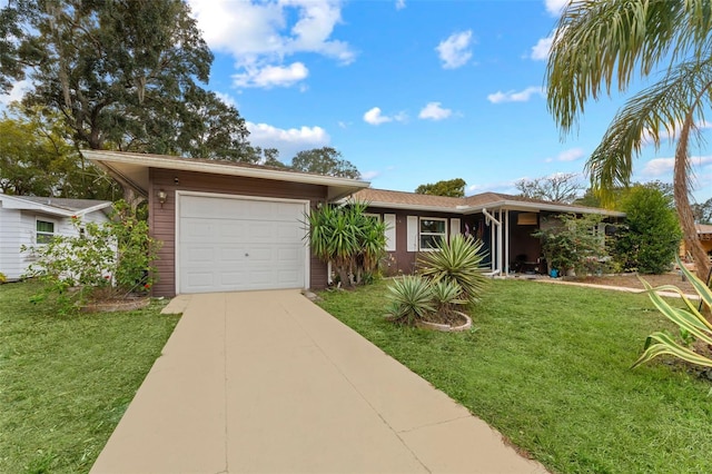 ranch-style house featuring a garage and a front lawn