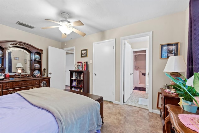 bedroom with ceiling fan and ensuite bath