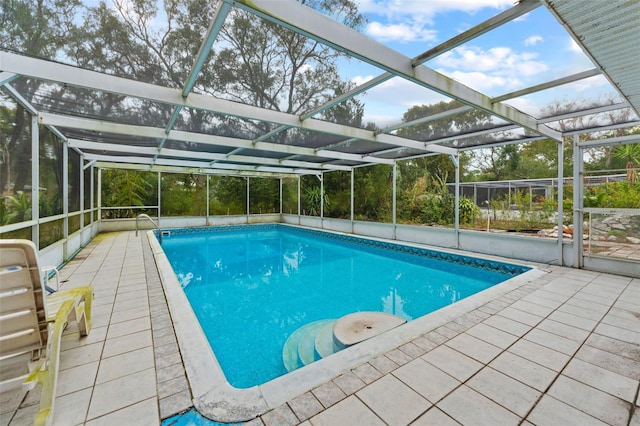 view of pool featuring a lanai and a patio