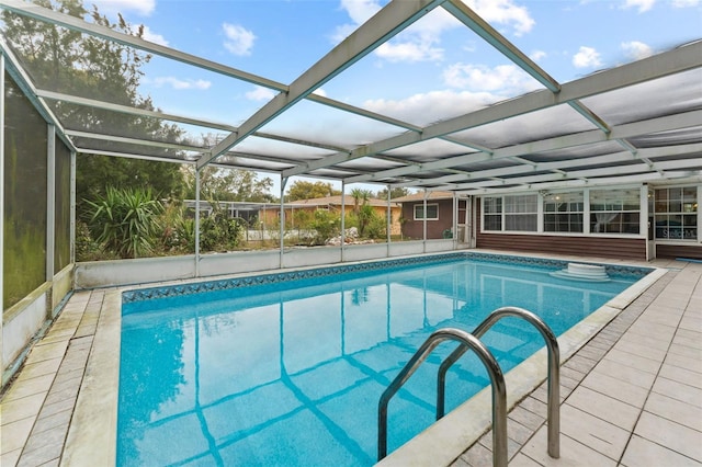 view of pool featuring a lanai and a patio