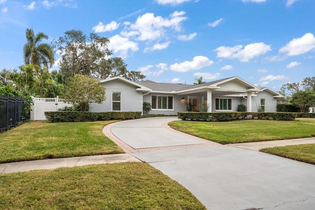 single story home with a front yard