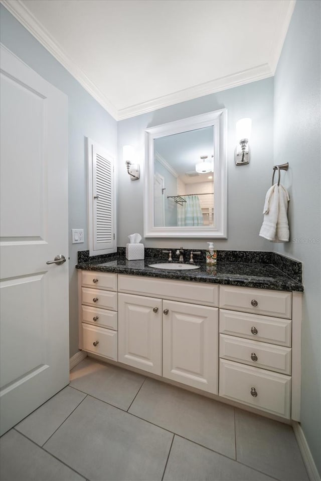 bathroom featuring crown molding, tile patterned floors, and vanity