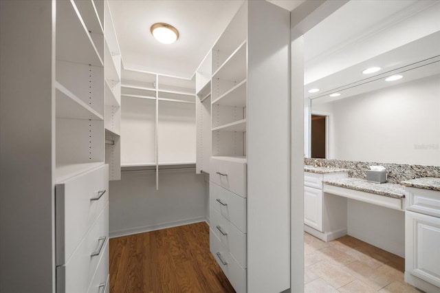 spacious closet featuring light wood-type flooring