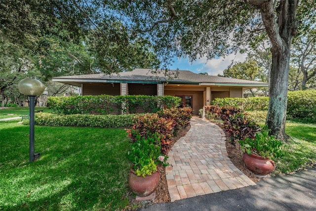 204 Lennox Rd W, W, Palm Harbor, FL 34683 - view of front of house with a front yard
