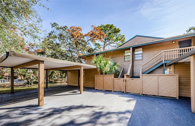 exterior space with a carport