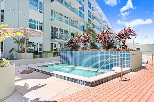 view of pool featuring a hot tub