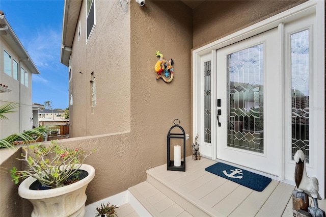 entrance to property featuring a balcony