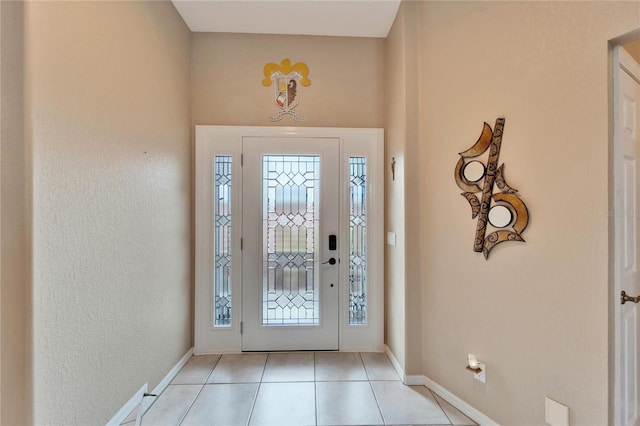 entryway with light tile patterned floors