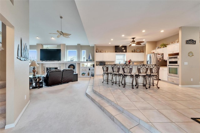 tiled dining room with ceiling fan