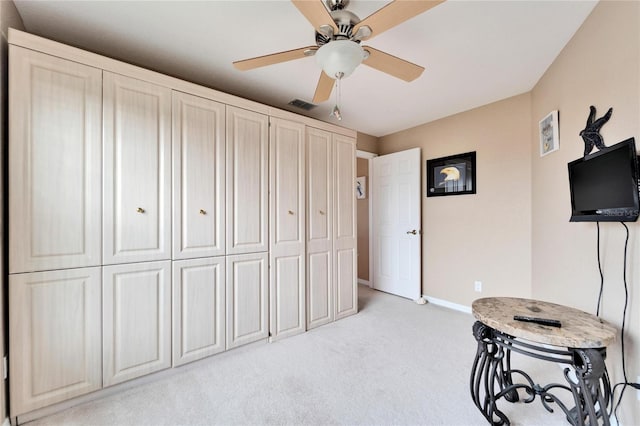 carpeted bedroom with ceiling fan