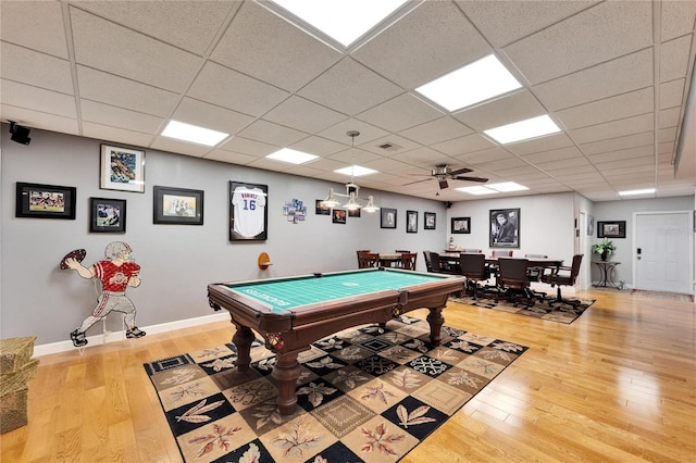 playroom featuring ceiling fan, pool table, light hardwood / wood-style floors, and a drop ceiling