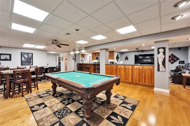 game room featuring light hardwood / wood-style floors, a paneled ceiling, billiards, and ceiling fan