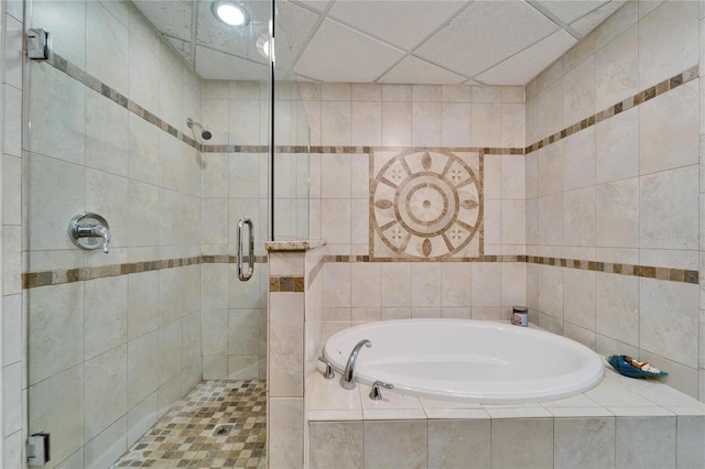 bathroom with a drop ceiling and plus walk in shower