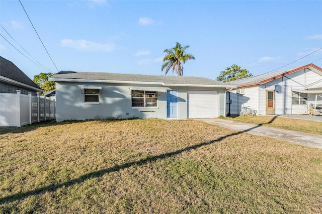 view of front facade featuring a front lawn and a garage