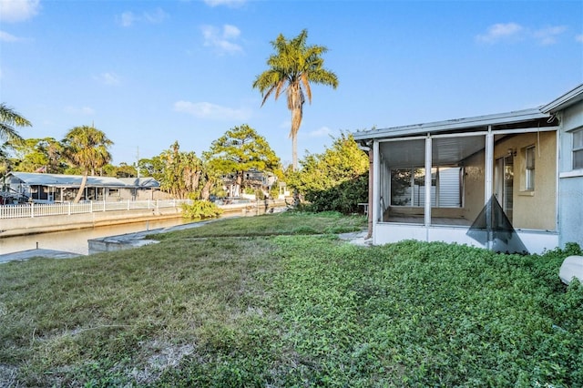 view of yard with a sunroom