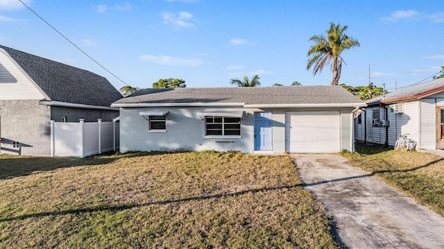 view of front of home featuring a front lawn and a garage