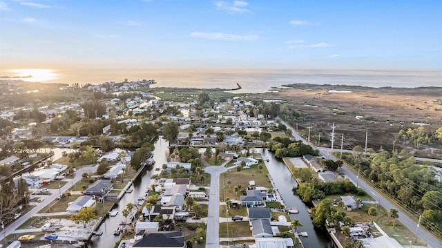 aerial view at dusk with a water view