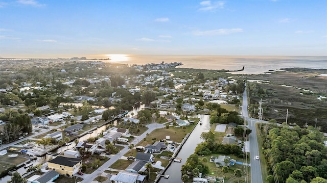 aerial view at dusk with a water view