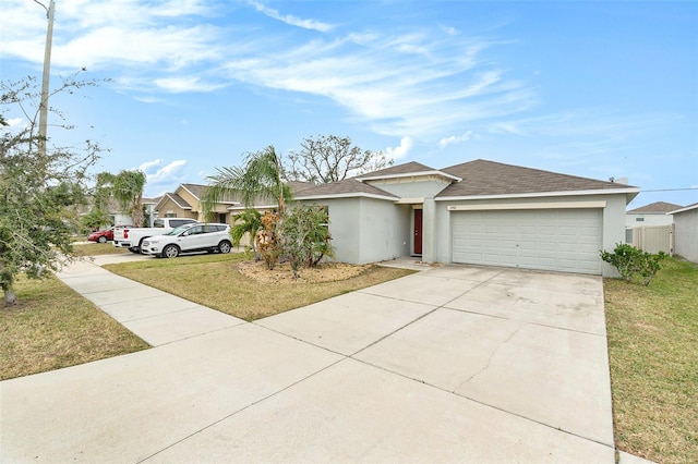 ranch-style home with a garage and a front yard