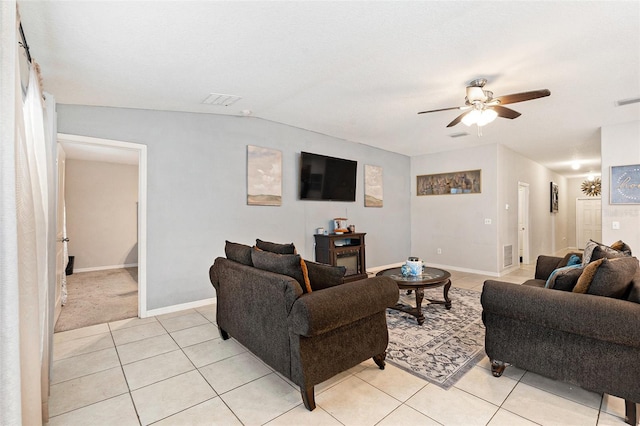 tiled living room with lofted ceiling and ceiling fan