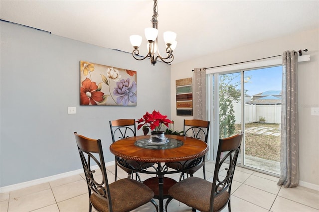 dining space with an inviting chandelier and light tile patterned flooring