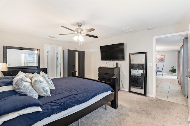 bedroom featuring ceiling fan and light colored carpet