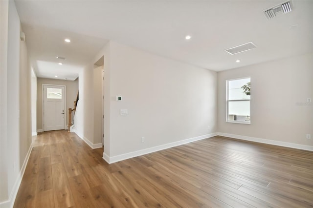 spare room featuring light hardwood / wood-style floors