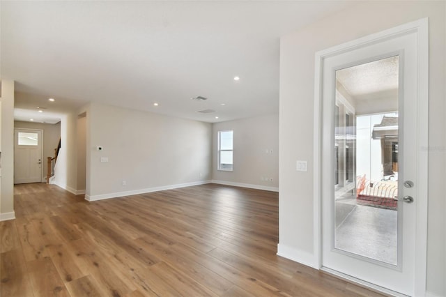 empty room featuring hardwood / wood-style flooring