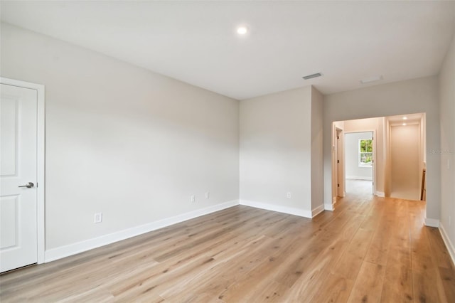 spare room with light hardwood / wood-style flooring