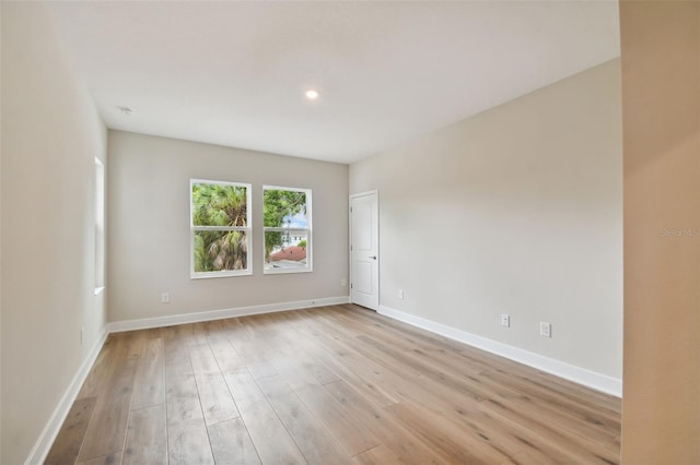 unfurnished room featuring light hardwood / wood-style floors