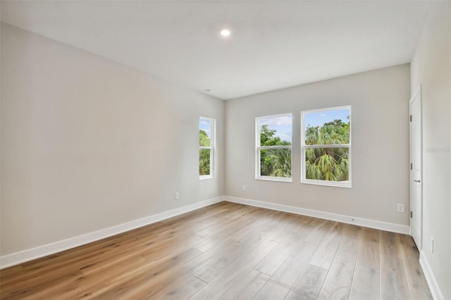 spare room featuring light hardwood / wood-style floors