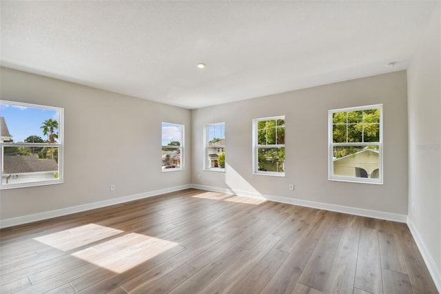 empty room with light hardwood / wood-style floors