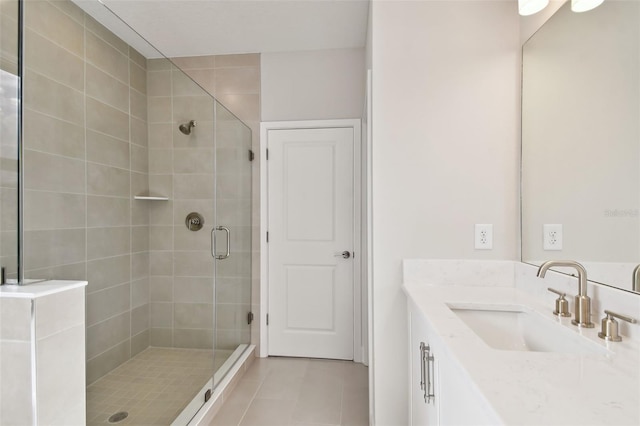 bathroom with vanity, tile patterned floors, and walk in shower