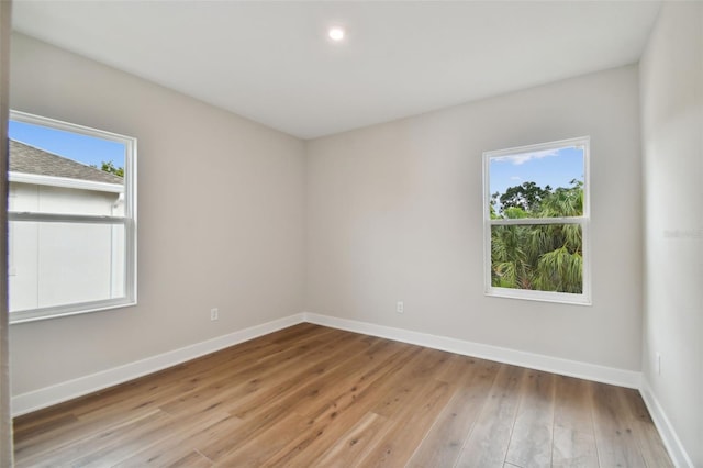 spare room featuring light hardwood / wood-style floors