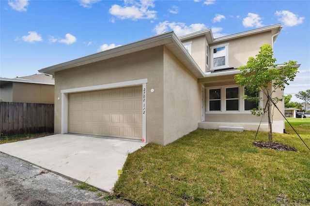 view of front facade featuring a garage and a front yard